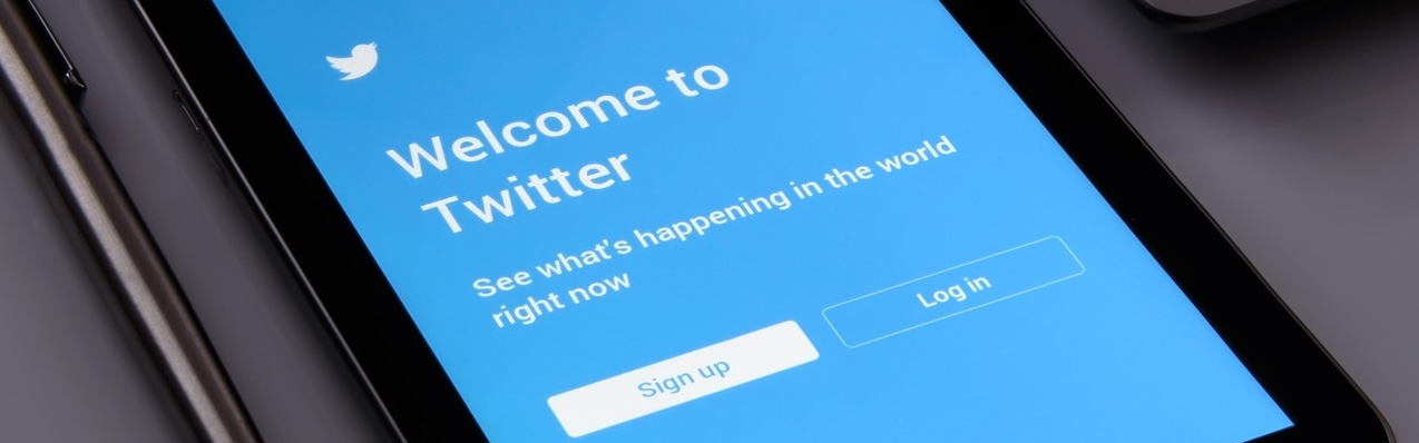 Photograph of an tablet on a desk displaying the sign on form for Twitter 