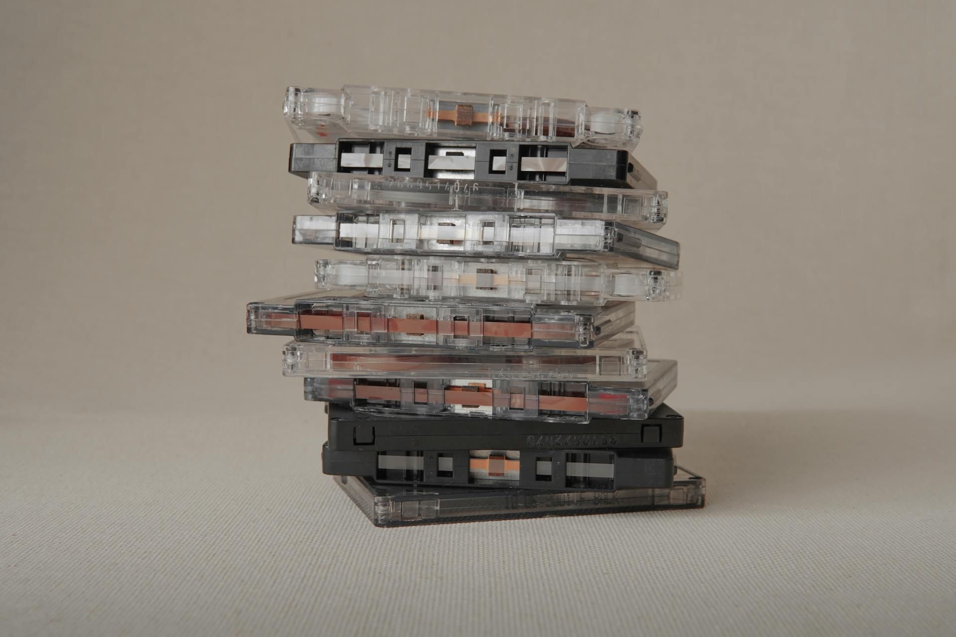 A stack of classic cassette tapes, showcasing retro music media A stack of classic cassette tapes, showcasing retro music media